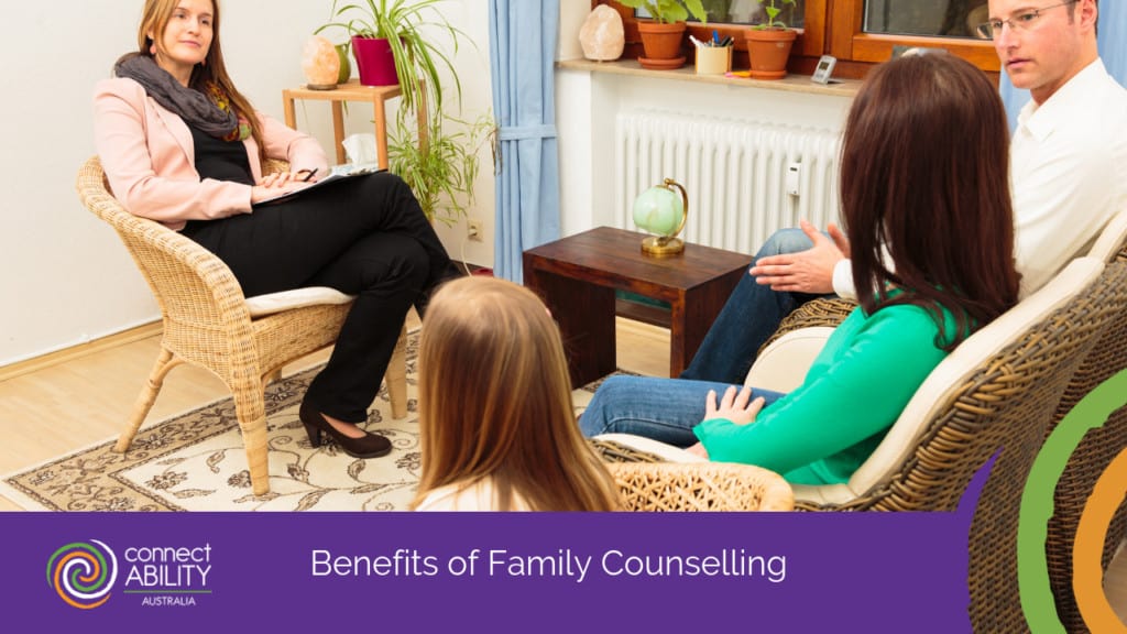 a family sitting in a session with a female counsellor