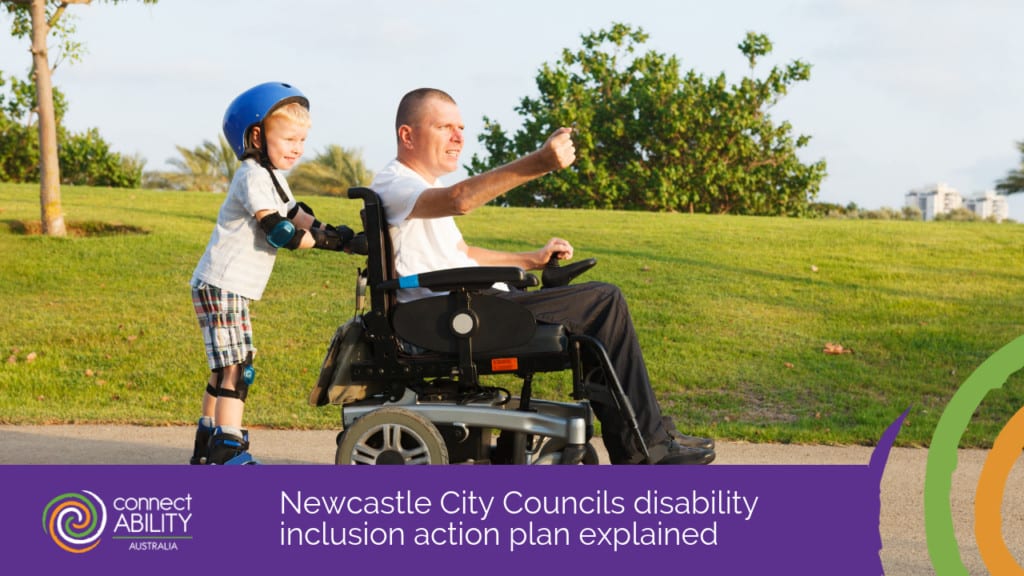 An image of a man in a motorised wheelchair with a young boy on rollerblades holding onto the back