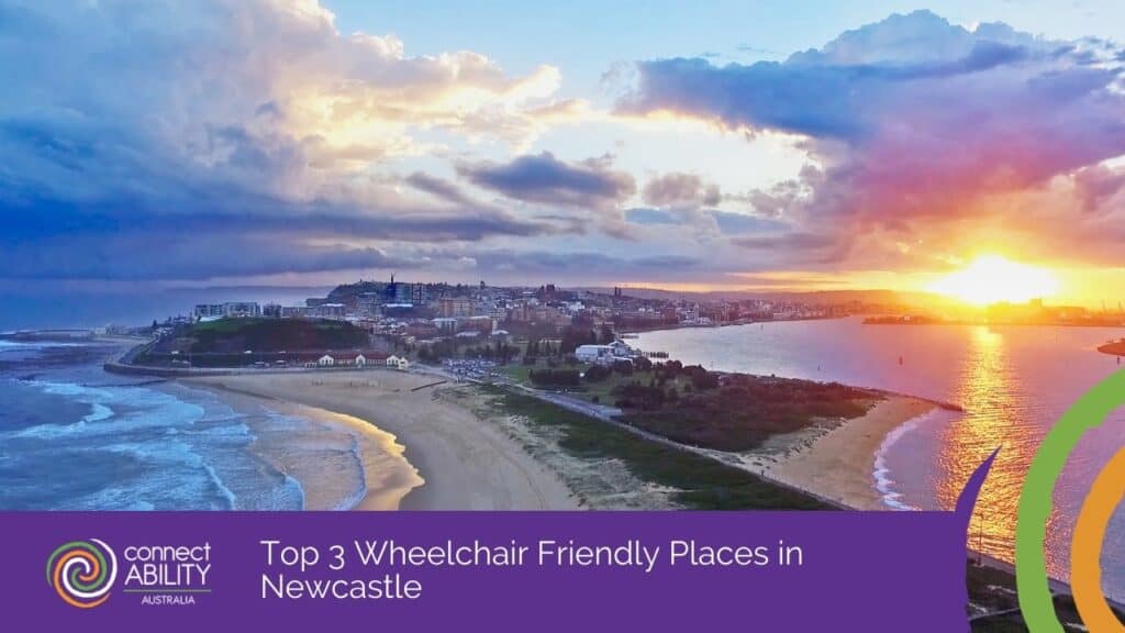 An aerial view of a coastal city and sandy beaches at sunset