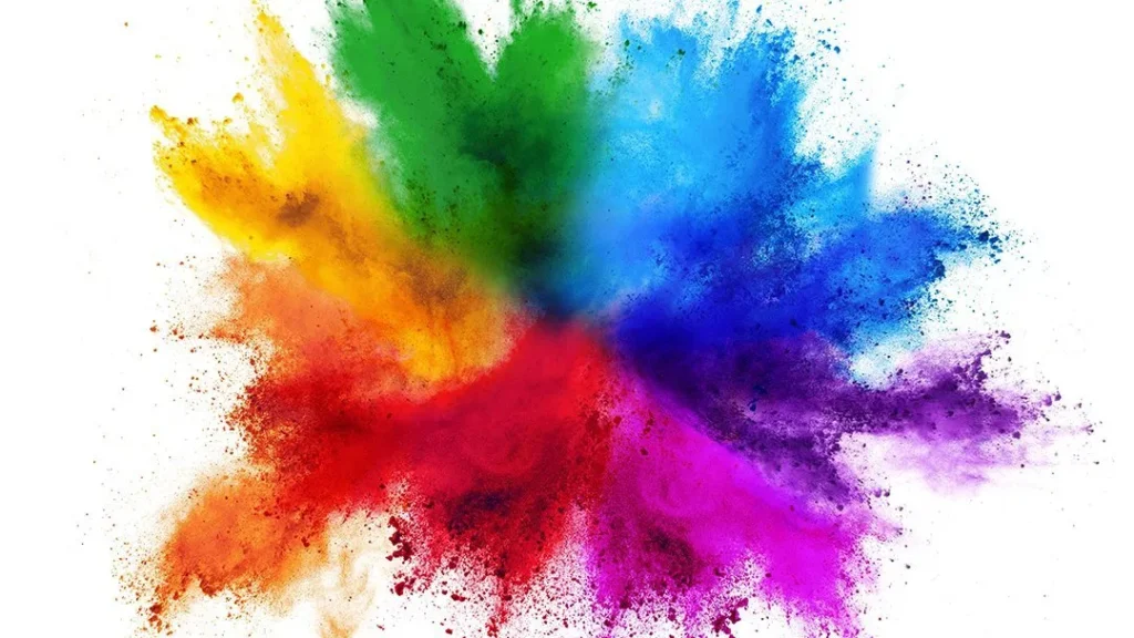 A vibrant explosion of multicoloured powder—yellow, green, blue, purple, pink, red, and orange