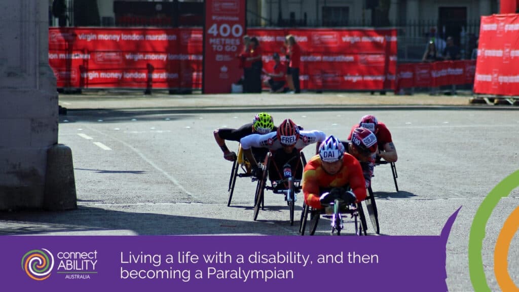 A group of wheelchair racers competing in a marathon on a paved city street