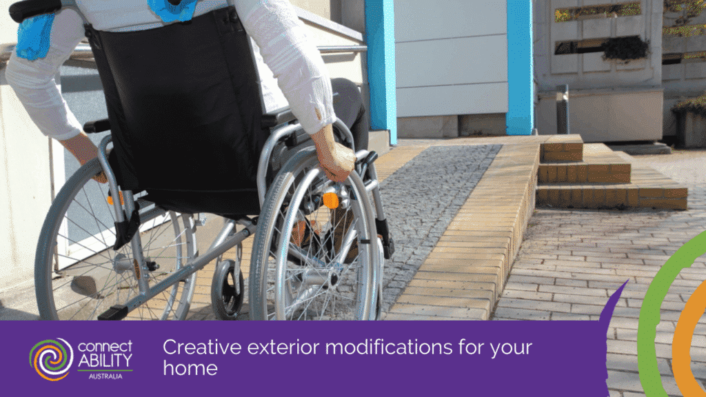 A person in a wheelchair navigating a stone and brick exterior ramp