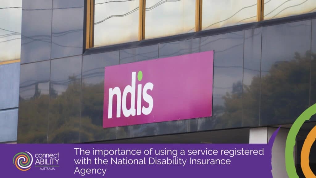 The NDIS logo on a purple sign outside a building