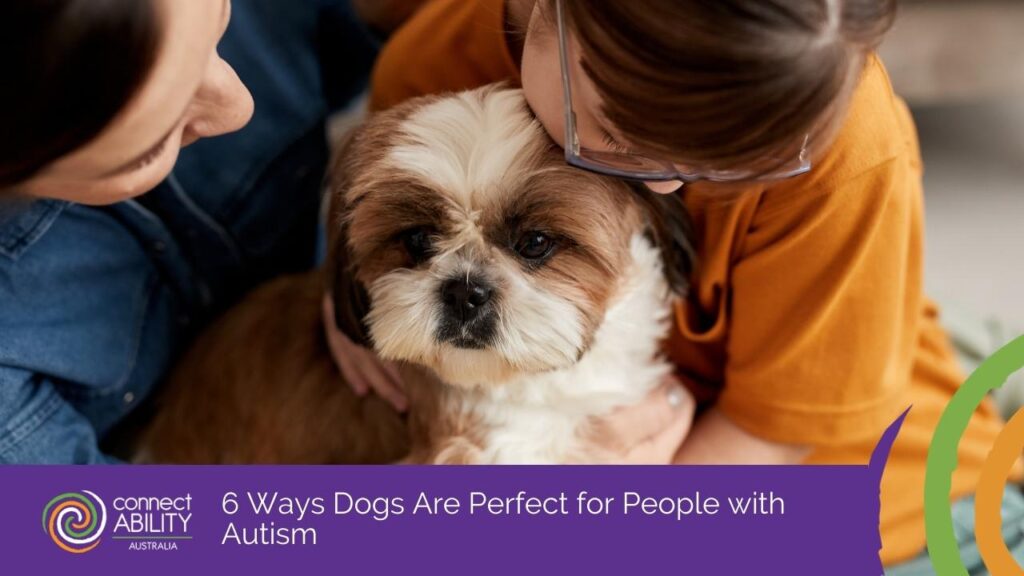 Two people affectionately hugging a small Shih Tzu dog